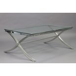 A chrome-finish low coffee table on x-shaped end supports joined by a centre stretcher, & with a