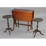 An Edwardian mahogany Sutherland table with canted corners to the rectangular top, & on square legs,