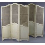 A pair of continental-style white painted wooden three-fold draught screens, each inset with woven-