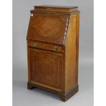 An Edwardian inlaid-mahogany narrow bureau having a fitted interior enclosed by a fall-front with