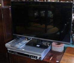 A Panasonic 32” LCD television; & a ditto DVD recorder, each with a remote control.