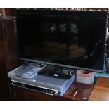 A Panasonic 32” LCD television; & a ditto DVD recorder, each with a remote control.