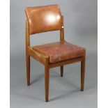 A mid-20th century teak side chair with a padded seat & back upholstered pig skin, & on round