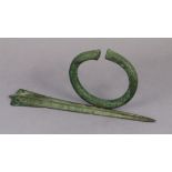 An Etruscan knife blade, 11¼” long; & a roman-style bronzed bracelet, 4¾” diameter.