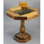 A carved wooden chess set of natural & ebonised stained (size of kings 3¼” high, lacking one pawn; &