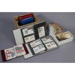 A collection of 130 GB First Day covers, 1948-1935, in two albums; and various GB & foreign stamps