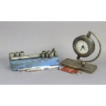A “Ford in Golf” desk clock in a silver-plated case, 6¼” high; a Ford tie-pin & keyring, etc.