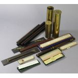 Three brass shell cases; a rosewood recorder (lacking mouthpiece); & various rulers.