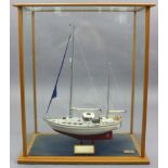 A Tony Carey model of the sailing boat “If And When II”, displayed in a glazed wooden case, 27¾”