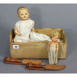 A composition baby doll, 12¾” high; a celluloid doll, 7¼” high; & two hunting knives.