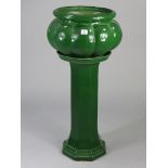 A Coonatta pottery (Australia) green glazed jardiniere & stand, 12¾” diameter x 31½” high (over-