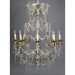 An antique-style gilt-metal frame chandelier hung with strands of beads & prism drops, 31” wide x