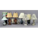 Nine various table lamps, each with shade.