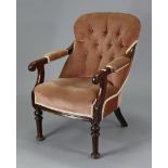A 19th century mahogany buttoned-back easy chair with a padded seat upholstered pink velour with