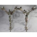 A pair of wrought-metal twin-branch large wall lights with scroll supports, 17” wide x 30” high; & a