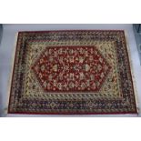 Four Persian pattern rugs (various sizes).