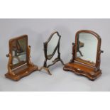 Three mahogany swing toilet mirrors.