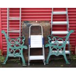 A pair of green painted cast-iron garden-bench supports, 31” high; together with a wooden garden pot