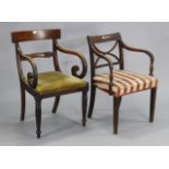 Two mahogany bow-back carver dining chairs, each with a padded seat.