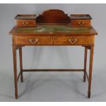 An Edwardian inlaid-mahogany ladies writing table inset gilt-tooled green leather to the rectangular