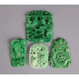 A group of four various Chinese carved & pierced jade pendants, the largest 3¼” x 2¾”.