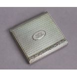 A George V silver flat rectangular pocket cigarette case with engine-turned decoration & cast floral