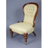 A Victorian mahogany frame spoon-back nursing chair, with buttoned back & padded seat upholstered