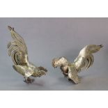 A pair of Sterling fighting cock table ornaments, 5¼” x 3¼” high. (8.3oz total).