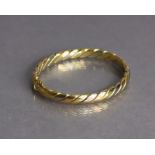 An 18ct three-colour gold stiff hinged bangle of rope-twist design (26.7g).