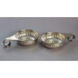 A pair of Mexican Sterling large fluted wine tasters, each with flat scroll handle, 4” dia. (10.