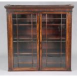 A late 18th/early 19th century mahogany bookcase upper section, with moulded cornice above three