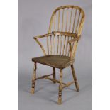 A 19th century ash & elm Windsor chair with hooped spindle-back, hard seat & turned legs with “H”
