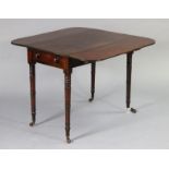 A Victorian mahogany pembroke table with rounded corners to the drop leaves, fitted single end