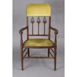 An early 20th century inlaid-mahogany elbow chair with padded seat & back upholstered green/gold