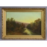 ENGLISH SCHOOL (19th century). A river landscape at sunset. Oil on canvas: 14” x 21”, in gilt