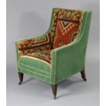 A late 19th century armchair with square back & downswept arms, part-upholstered in carpet sections,