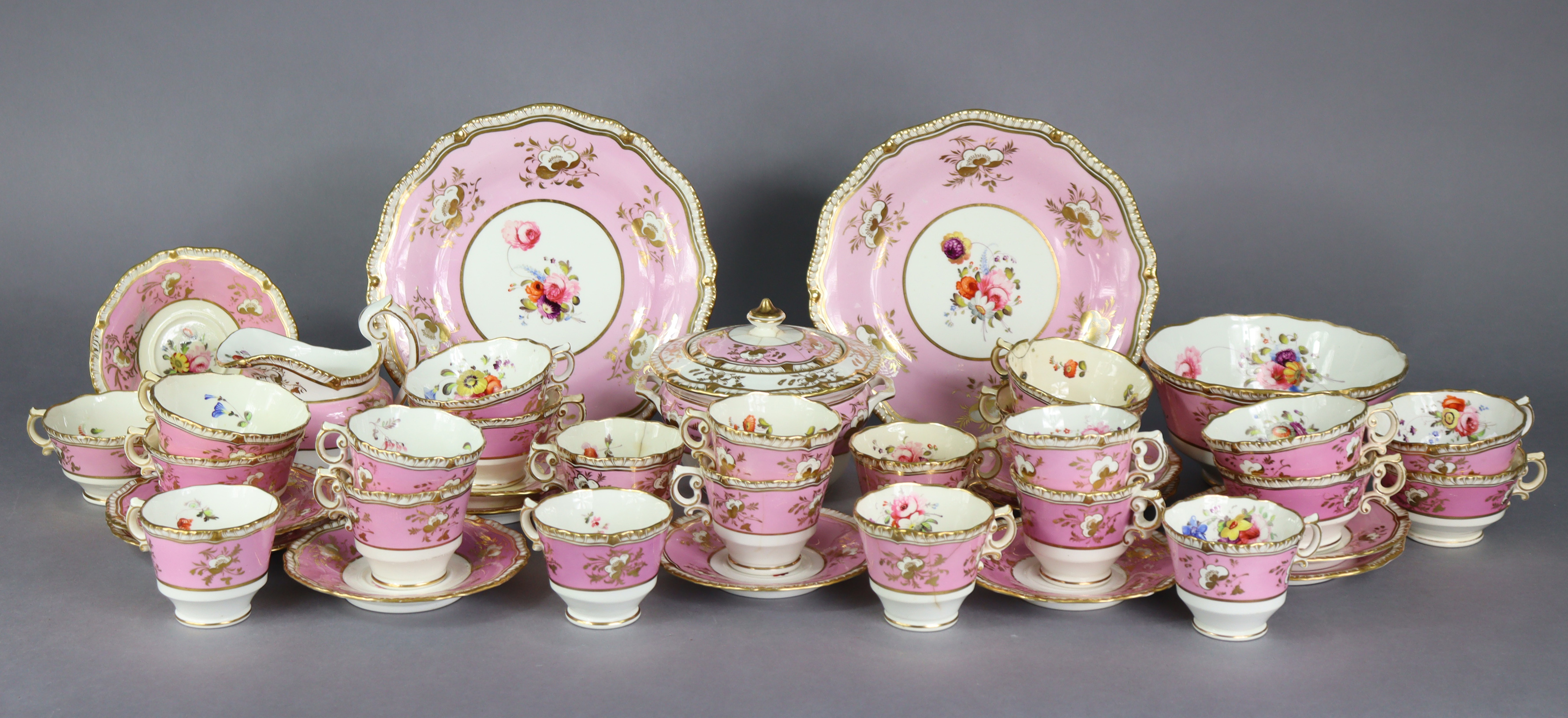 A 19th century English porcelain part tea & coffee service of pink ground with gilt banding & floral