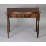 A Georgian mahogany tea table of serpentine shape, with fold-over top, fitted with a frieze drawer