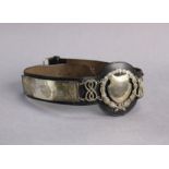 A leather dog collar with George V silver mounts, 21” long, Birmingham 1930 by W.H. Haseler Ltd.