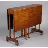 A Victorian mahogany Sutherland table with rounded corners to the rectangular drop leaves, on turned