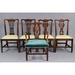 A matched set of five Georgian mahogany dining chairs comprising: two pairs of singles, & one