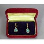 A pair of 10K earrings, each with pendant pear-shaped black opal (3.1 gm gross).