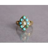 A Victorian 15ct gold ring with navette-shaped panel set split pearl within a border of turquoise