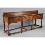 An 18th century pine low dresser with stage back & moulded edge to the rectangular top, fitted three