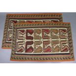 A pair of South West Persian Qashgai kilim rugs of ivory ground, each with rows of multicoloured