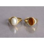 A yellow metal ring set oval split pearl, size L, weight 4.8g; & a 9ct gold ring set oval tiger’s-