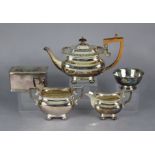 A Georgian style silver-plated three-piece tea set of oblong form with gadrooned rims & bun feet; to