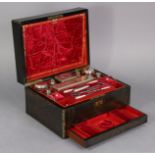 A Victorian coromandel & brass-inlaid travelling case by Merrick of London, with gilt-tooled crimson