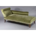 A Victorian mahogany chaise longue upholstered green velour, on turned tapering legs with ceramic