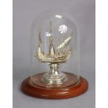 A continental silver model of a 17th century galleon in full sail, on circular pedestal (loaded),